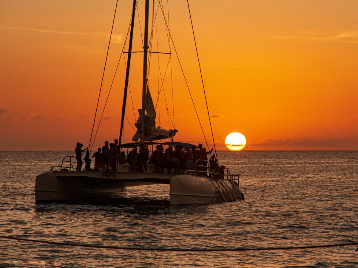 A catamaran on a sunset cruise