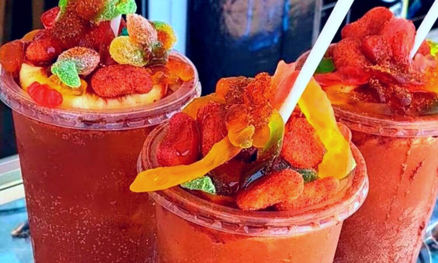 Gomichelas - A beer with lime juice, chamoy, tajin and topped with gummies