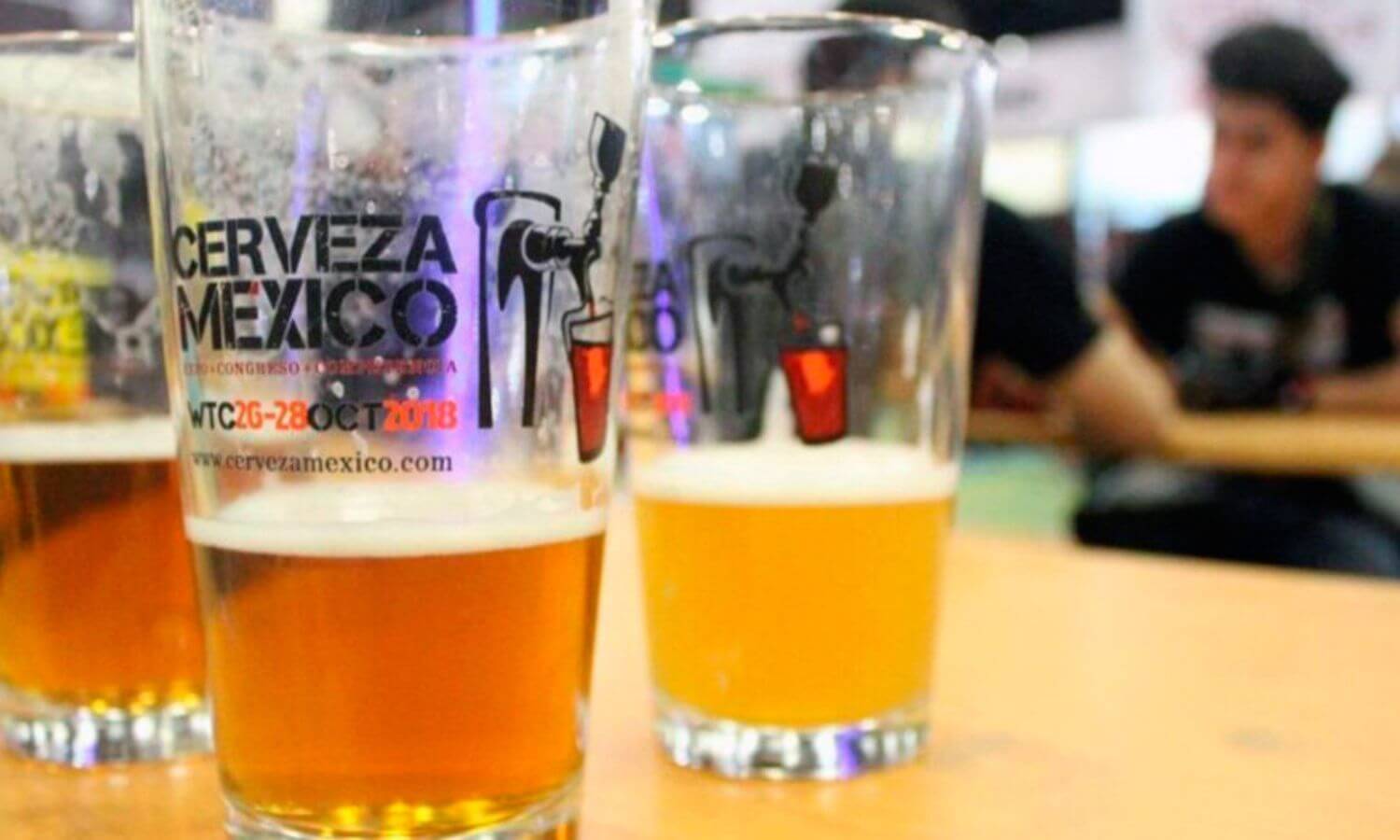 Three half empty glasses of beer at the Expo Cerveza in Mexico City