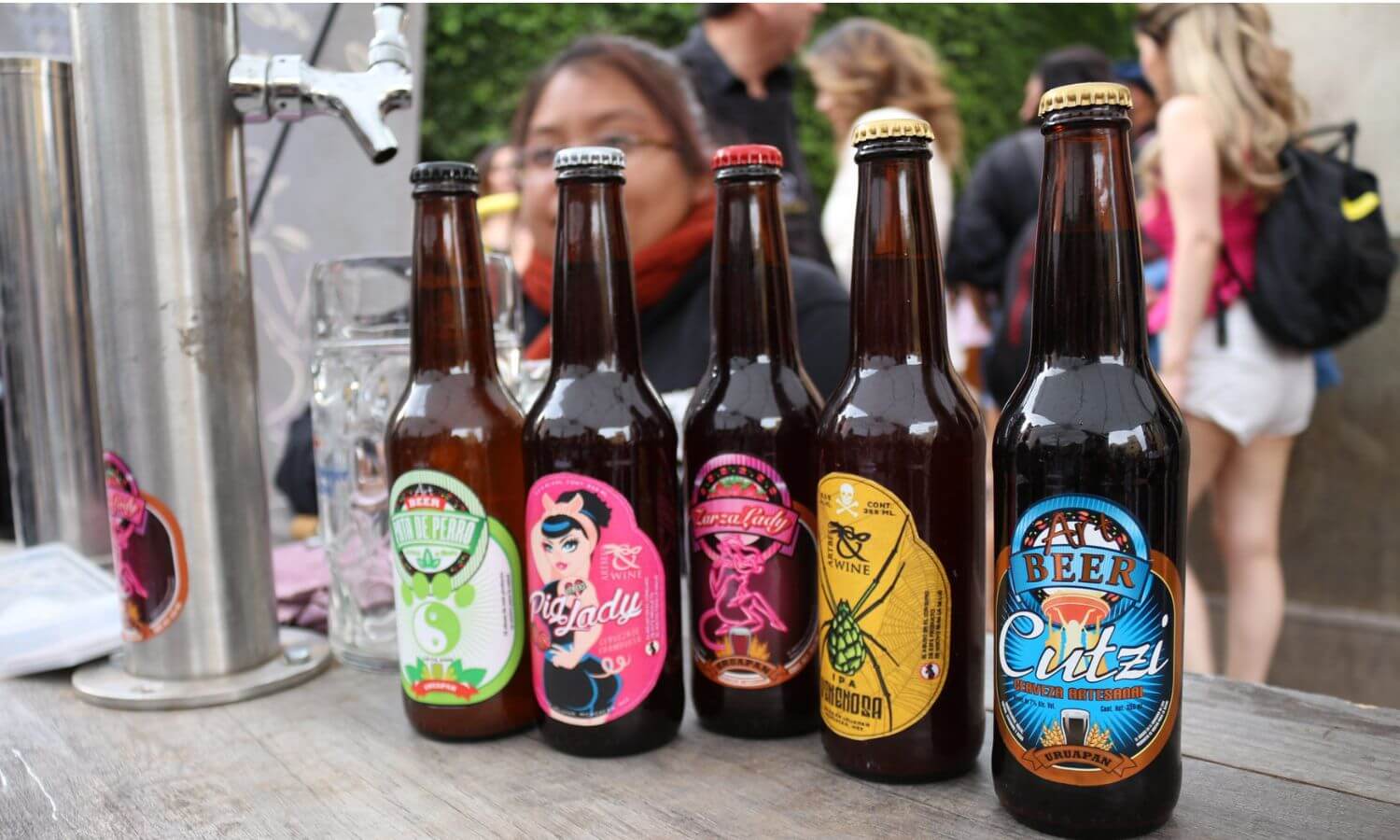 Five bottles of craft beer at the Expo Cerveza in Mexico City