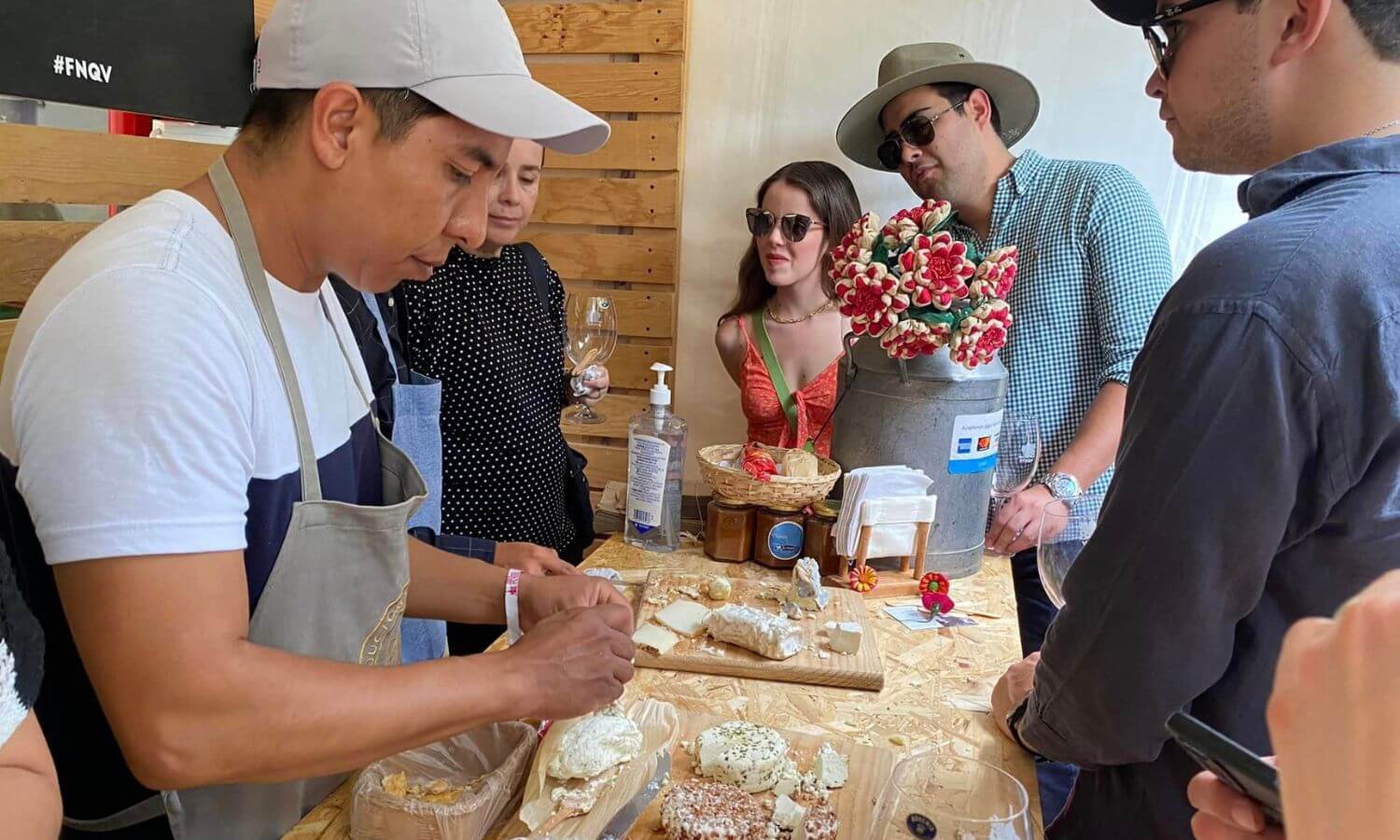 People sampling cheese at a stall in the Feria Nacional del Queso y el Vino in Tequisquiapan