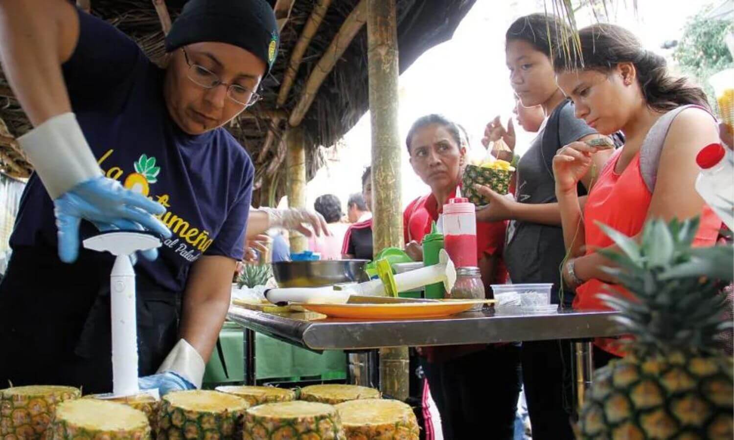 People waiting for fresh pineapple at the Festival de Pina in Oaxaca.