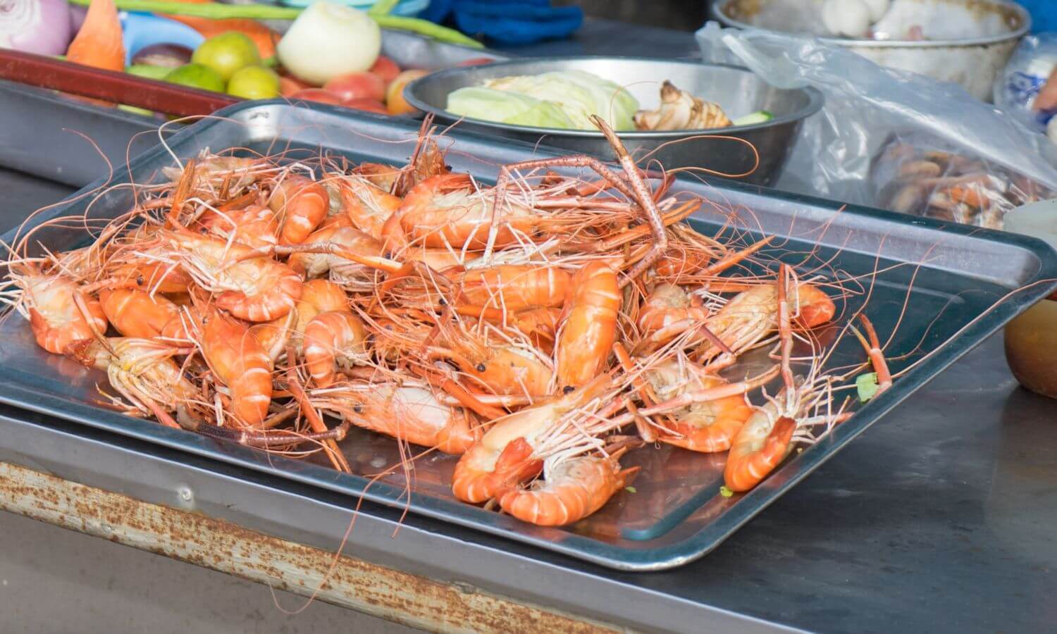 Cooked whole shrimp on a baking tray at the Festival del Cameron.