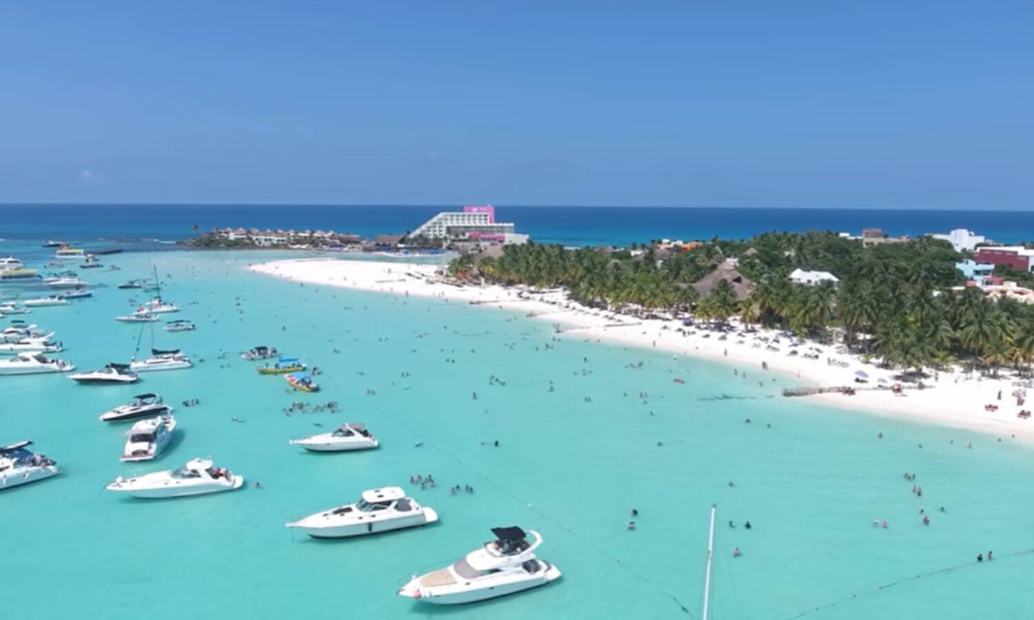 Luxury yachts moored of Playa Norte, Isla Mujeres. Mia Reef hotel at the top of the picture. The best beach on Isla Mujeres?