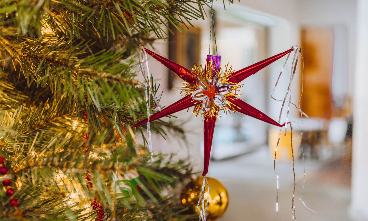 Piñata Christmas Ornament hanging on a Christmas Tree