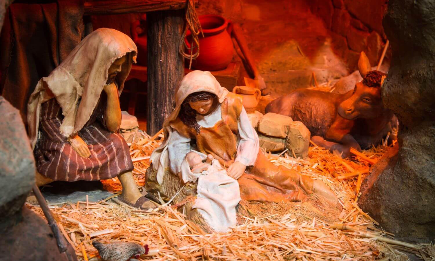 Traditional Nacimiento in Mexico, Joseph, and Mary with the baby Jesus in a stable with a donkey.