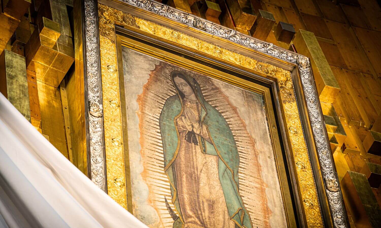 A picture of the Virgen de Guadalupe in a church.