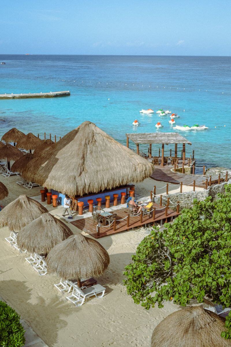 Playa Azul Beach Club's palapa bar next to the ocean.