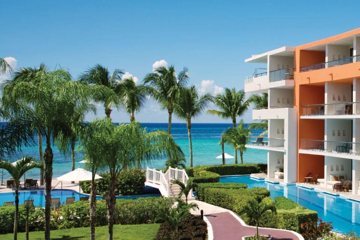 Looking from a room at Secrets Aura Cozumel Resort, over the pool towards the ocean.