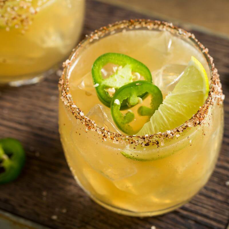 A margarita with a spicy rim and added sliced jalepenos.