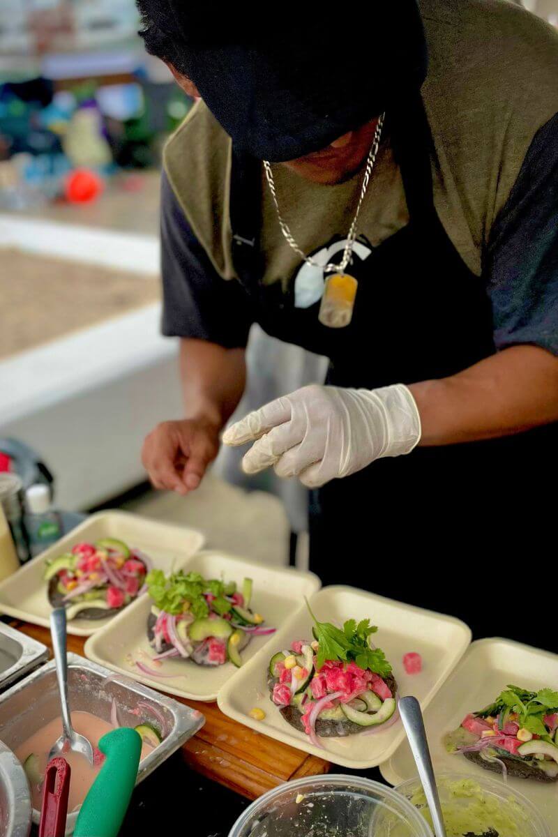 Tuna ceviche being served on homemade corn tostadas at the 'festival tradicional del ceviche'