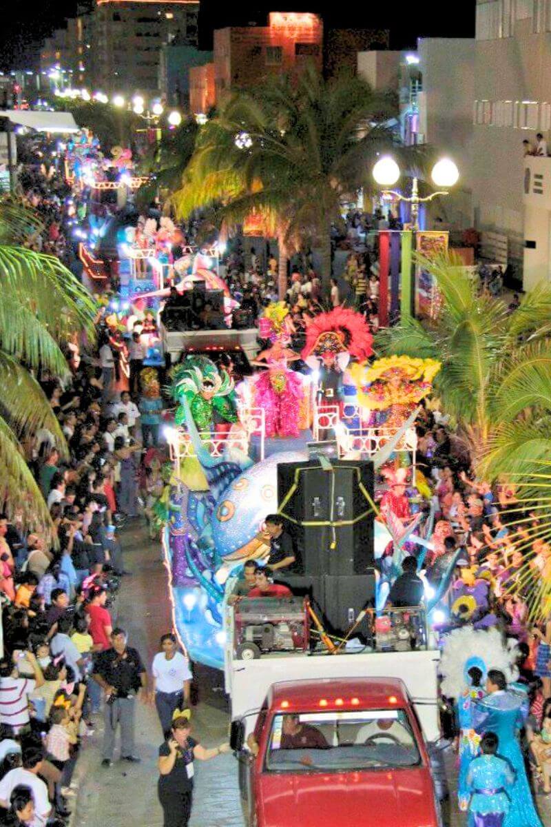 The carnival floats heading down a street in Cozumel.