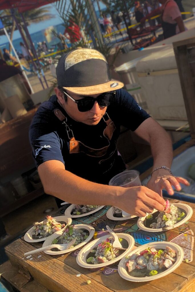 Plates of food being prepared at the Mexican Caribbean Food Festival