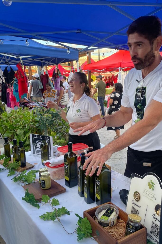 Locally made olive oils being sold on a market stand at the Food festival in Puerto Morelos.