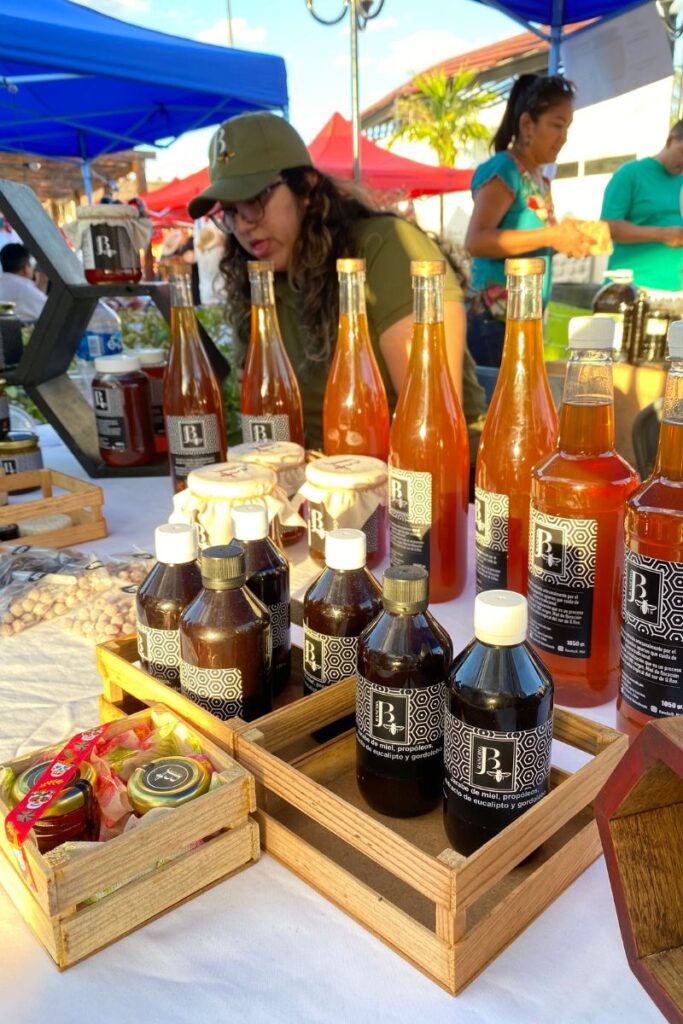 Local honey being sold on a market stand at the Food festival in Puerto Morelos.