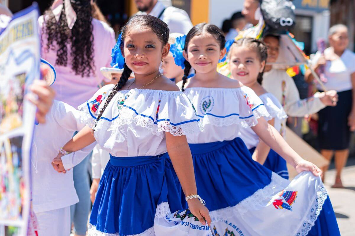 mexican girls in traditional dress celebratin el dia del nino