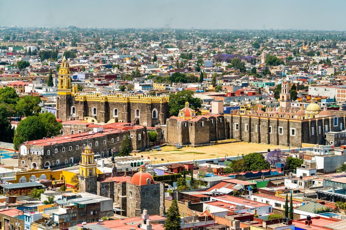 A view over the town showing several beautiful churches in Cholula, Mexico.