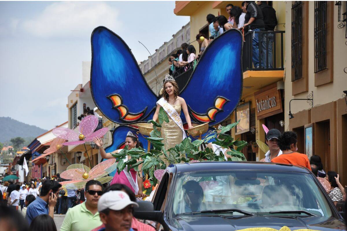 Women dressed as butterflies on a float in an Easter parade in Mexico.