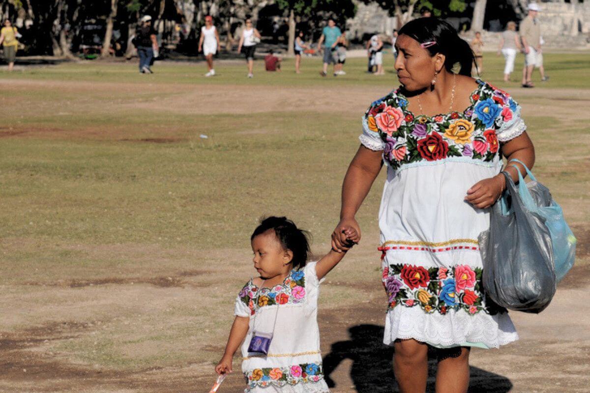 mayan mother walking with her young child