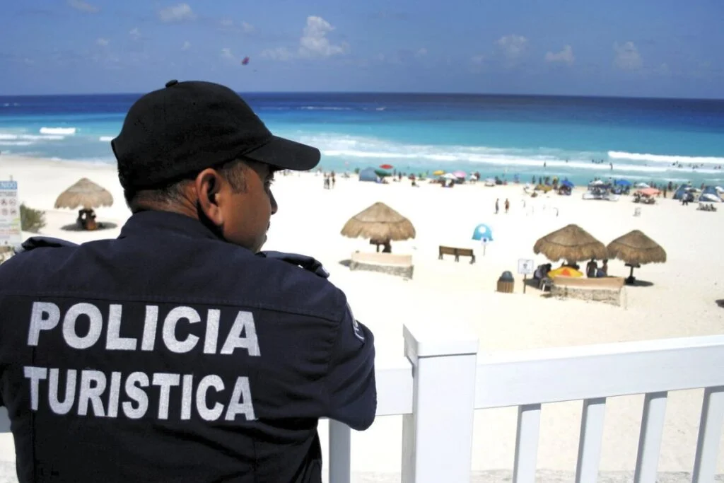 Tourist police officer overlooking a beach in mexico