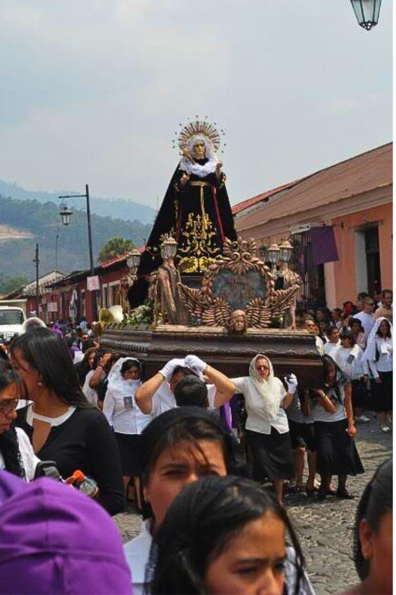 A statue of the Virgin Mary bieng carried through town on viernes de Deolores (Friday of Sorrows)