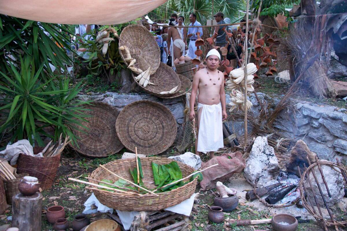a reenactment of a traditional maya trading post at xcaret