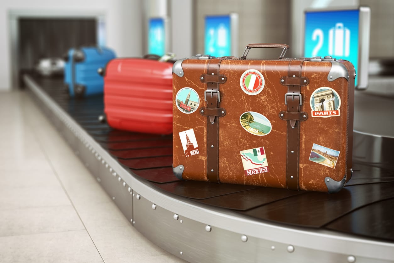 Luggage In Cancun Airport Old vintage suitcase on a airport luggage conveyor belt. Baggage claim. Travel and tourism concept background. 3d illustration
